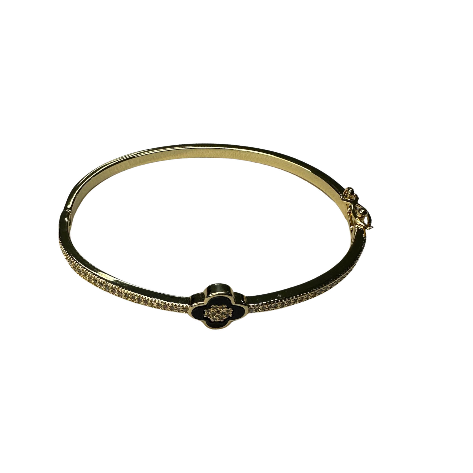 Expertly crafted with a gold finish, this Black Clover Cuff Bangle boasts a sophisticated and timeless design. With a convenient clasp closure and elegant black clover accent, this bangle is the perfect addition to any outfit. Elevate your style with this stunning accessory.