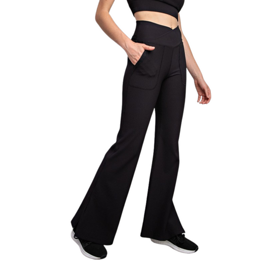 These black V-waisted flared leggings from Rae Mode combine style and function with a tailored fit that enhances your silhouette. Crafted from durable nylon, they offer breathable support and flexibility for all-day comfort. The high V-waisted design provides core stability and a flattering shape, while the flared leg adds a modern touch that pairs well with various tops and footwear. Ideal for both active wear and casual outings, these leggings deliver a versatile addition to your wardrobe with expert-qual