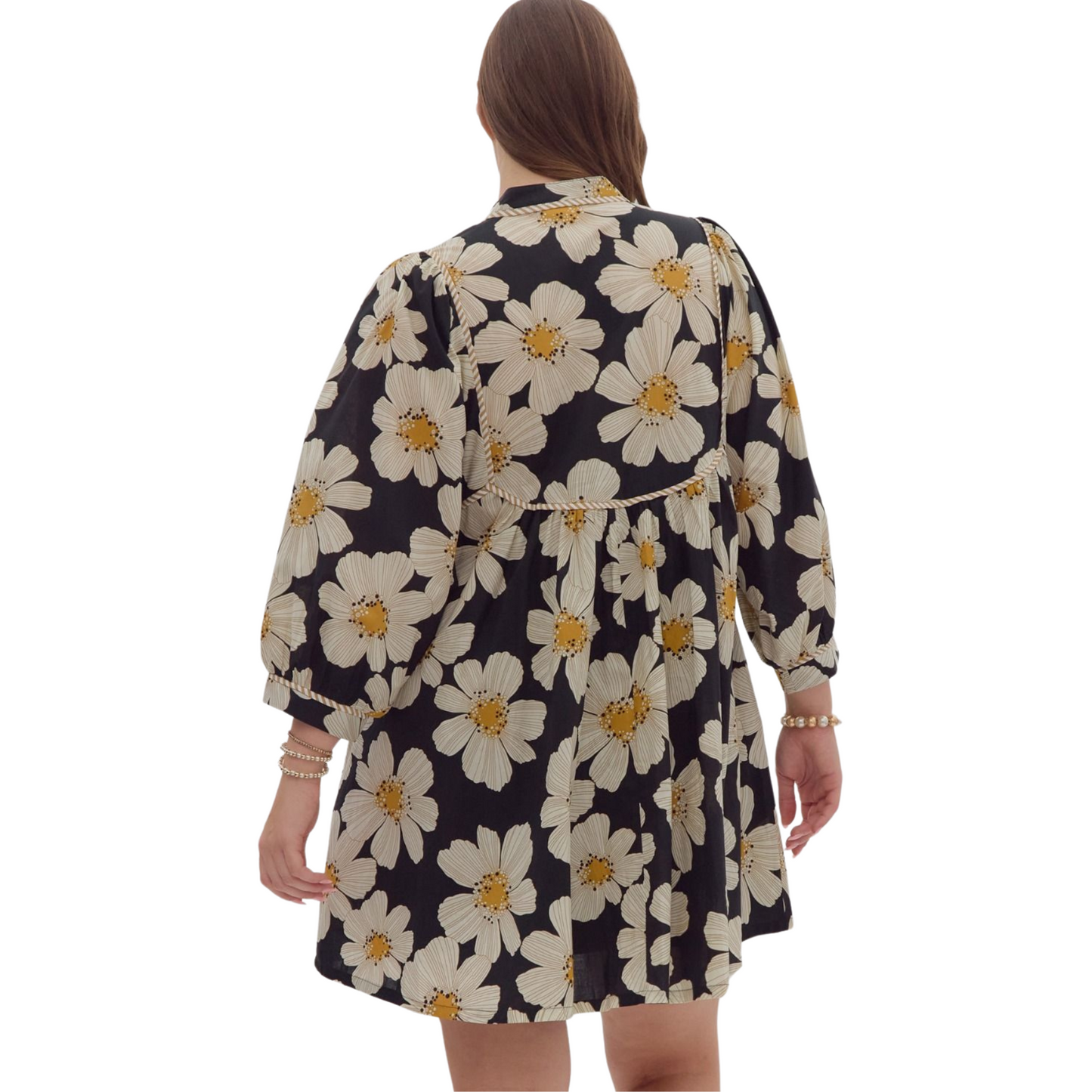 Expertly crafted with a sleek black floral print, this mini dress is designed with 3/4 sleeves, a stylish v-neckline, and ruffled details. The addition of pockets at the side, self tie detail, and lightweight, non-sheer woven fabric make it both functional and fashionable. Perfect for any occasion.