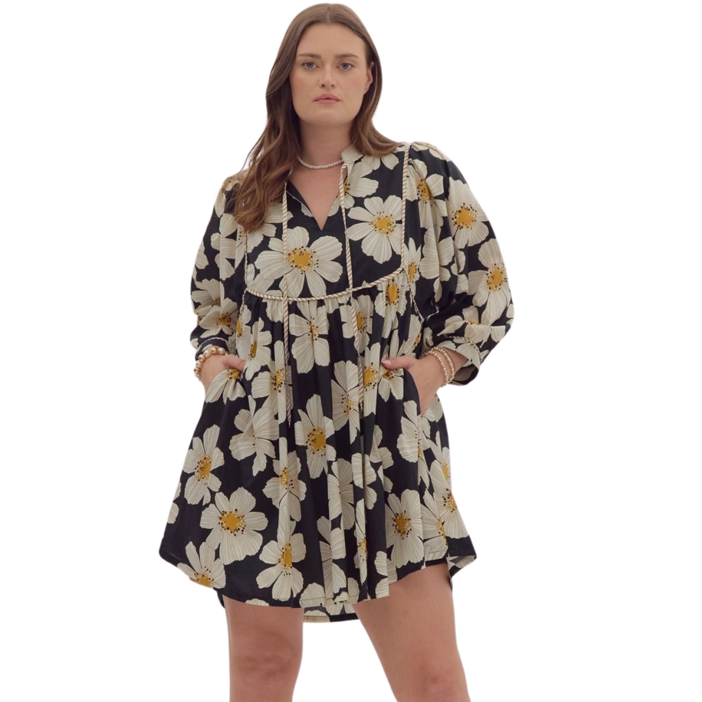 Expertly crafted with a sleek black floral print, this mini dress is designed with 3/4 sleeves, a stylish v-neckline, and ruffled details. The addition of pockets at the side, self tie detail, and lightweight, non-sheer woven fabric make it both functional and fashionable. Perfect for any occasion.