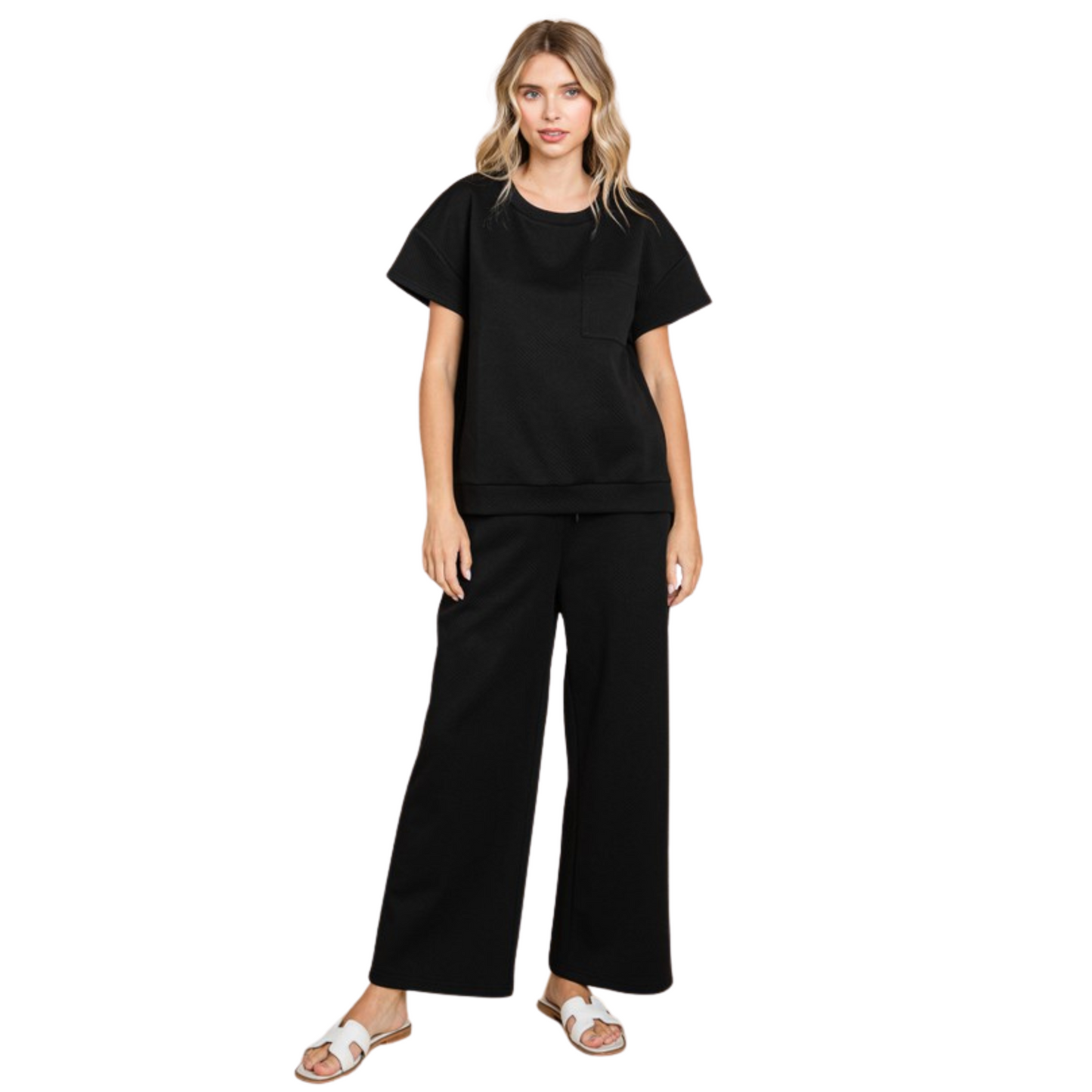 This black top and bottom set features a textured U-neck top with short kimono sleeves and band hems. Made of lightweight, non-sheer fabric, this set offers comfort and style. Perfect for any occasion, a must-have for any wardrobe. Model is 5'8'' and is wearing a Small. 