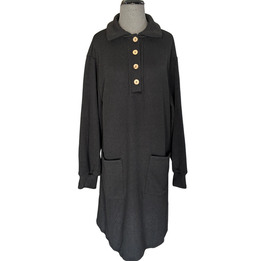 This black, long sleeve knit dress from She + Sky features a classic half button-up design with a structured collar for a polished look. Practical pockets add everyday convenience, while the soft knit fabric ensures comfort throughout your day. Ideal for layering or wearing on its own, this dress combines effortless style with functional details.