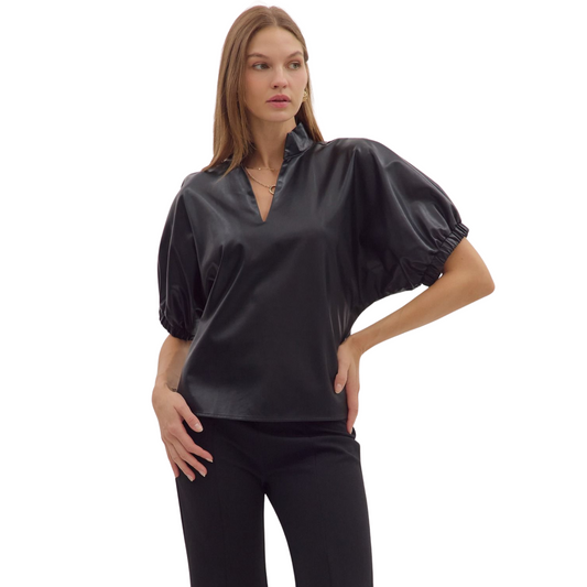 Elevate your wardrobe with this expert-crafted Solid Puff Sleeve Top by Entro. Featuring a flattering black V-neck and short puff sleeves, it balances classic style with a modern twist. Designed for both comfort and sophistication, this top is perfect for layering or wearing on its own for a polished, professional look.