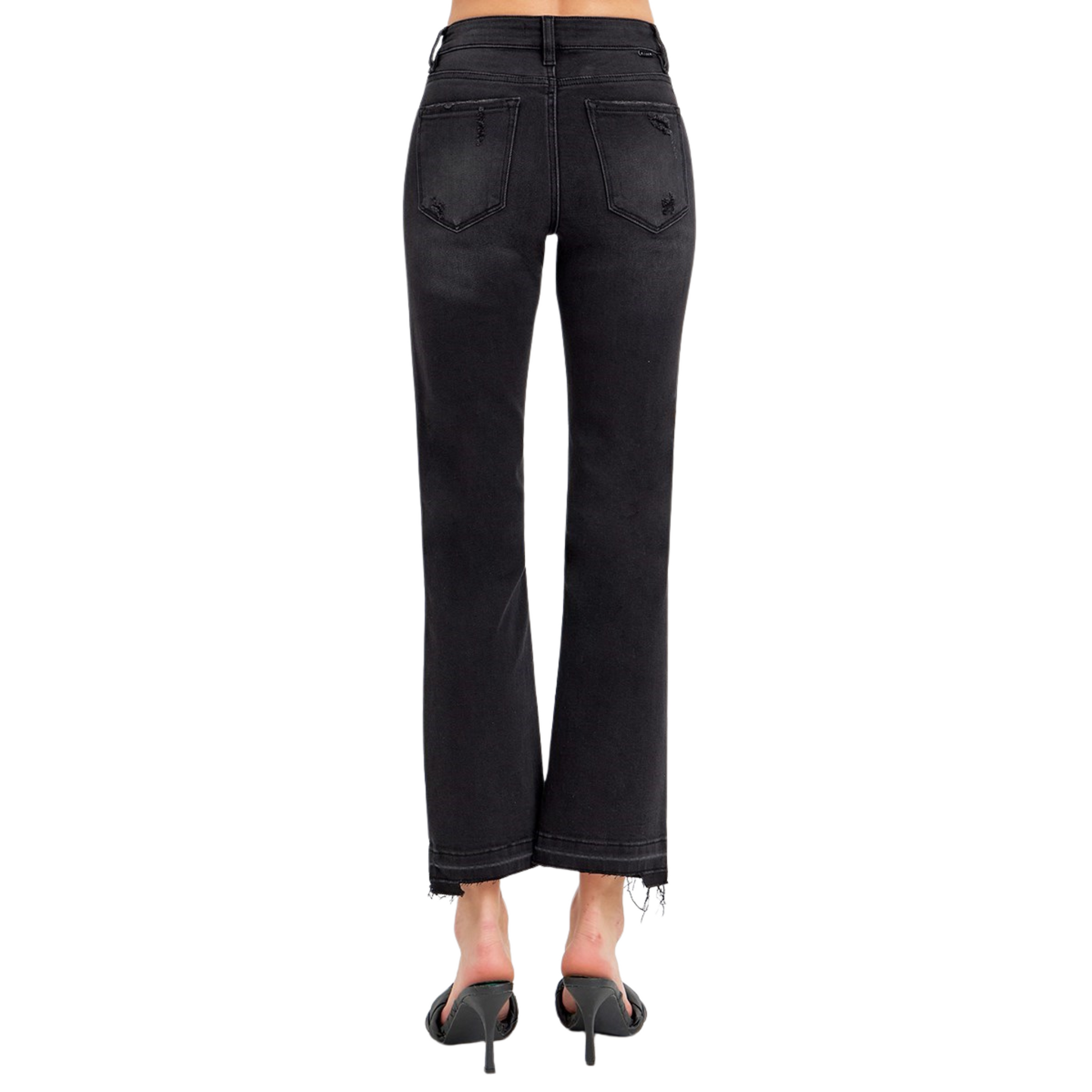 Expertly crafted by the Risen brand, these Mid Rise Uneven Released Hem Jeans feature a flattering mid rise and a versatile cropped length. The black denim fabric adds a touch of sophistication, while the raw hem creates a chic, edgy look. Elevate your wardrobe with these stylish and on-trend jeans.