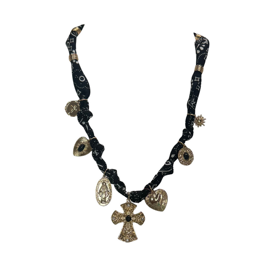 Elevate your style with this sophisticated short scarf necklace from Golden Stella. Featuring delicate gold charms, it combines the elegance of fine jewelry with the versatility of a scarf, perfect for adding a refined touch to any outfit. Crafted for comfort and style, this piece is ideal for those seeking a unique accessory that blends classic charm with modern design.