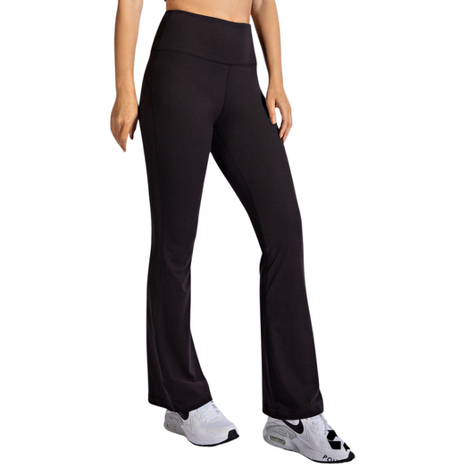 Experience the perfect blend of style and comfort with Rae Mode's black high waist band yoga pants. Designed with a flattering high waistband, these bell-bottom pants offer both support and freedom of movement. Ideal for yoga or everyday wear, they provide a sleek silhouette while ensuring all-day comfort and flexibility. Elevate your activewear collection with this expertly crafted piece from Rae Mode.
