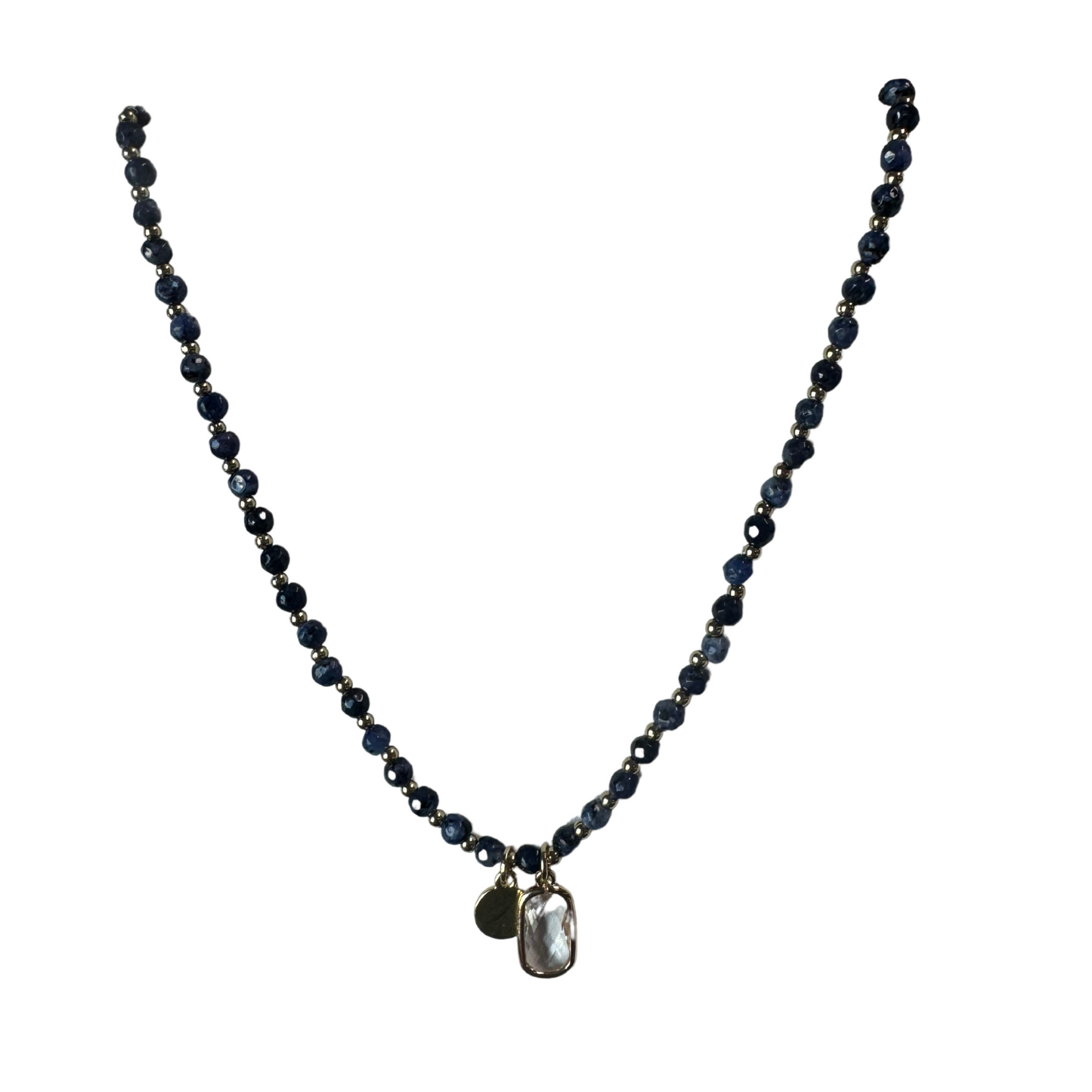 This elegant beaded necklace features a stunning clear rectangle pendant, adding a touch of sophistication to any outfit. The Euro Collection design creates a short necklace perfect for everyday wear. Adorned with a blue bead, this necklace offers a unique and timeless addition to your jewelry collection.