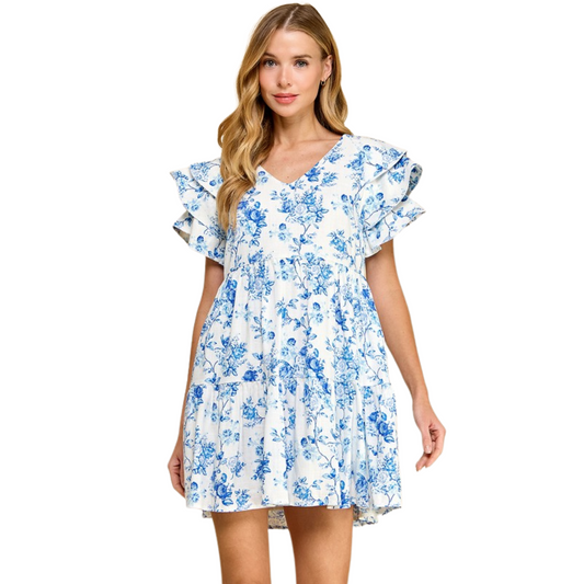 This Floral Print V-Neck Pullover Dress by TCEC features a beautiful blue floral print and a flattering v-neck design. Perfect for any occasion, this mini dress combines style and comfort for a timeless look. Elevate your wardrobe with this must-have piece from TCEC.