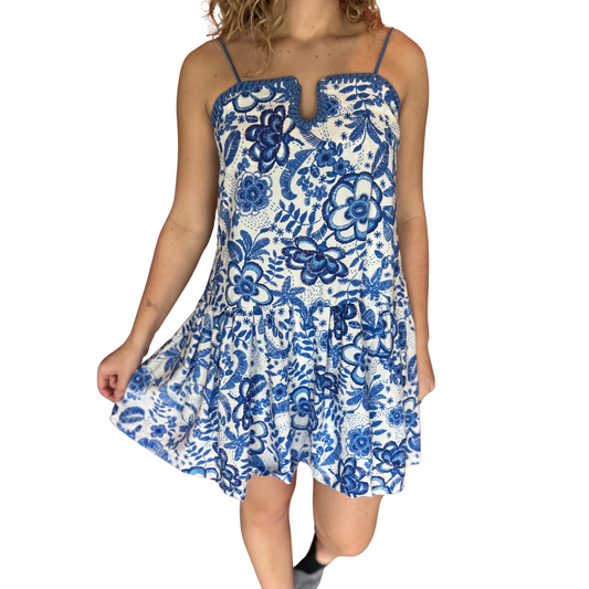 Expertly designed by TCEC, this floral spaghetti strap dress features a stunning blue floral print and a mini length for a chic and stylish look. With delicate spaghetti straps, it offers a flattering fit and effortless elegance. Perfect for a multitude of occasions, this dress is sure to become a staple in your wardrobe.