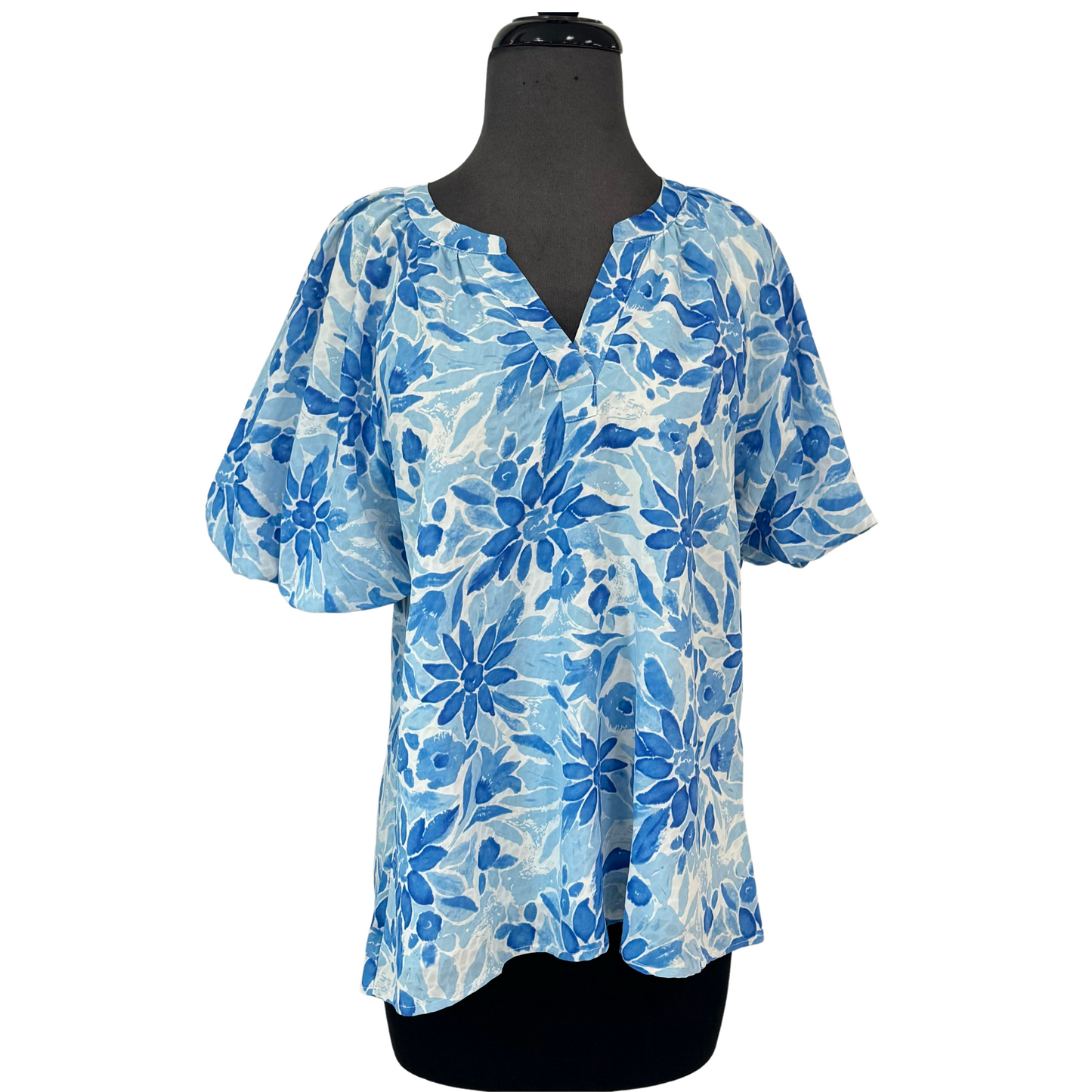 This lightweight Floral Top features a beautiful lt blue floral design on a lined fabric. The airy fabric provides comfort and style for any occasion. Perfect for a casual look, or dress it up for a more sophisticated ensemble.