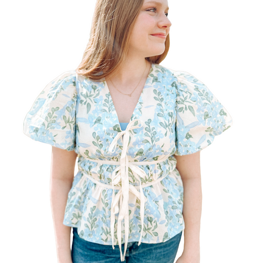 Expertly crafted and designed with scientific precision, this Floral Print Puff Sleeve Top is the perfect blend of style and functionality. Its elasticated ¾ puff sleeves and scallop trim add a touch of elegance, while the lightweight, non-sheer woven fabric ensures comfort and durability. A must-have addition to any wardrobe.