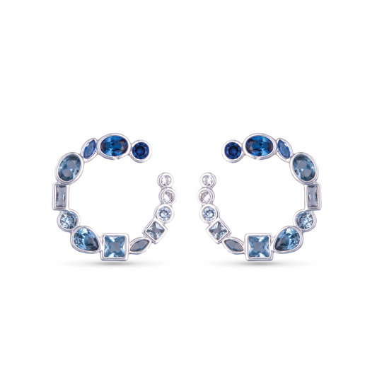 These hoop earrings feature stunning blue stones set in silver, making them a versatile and eye-catching addition to any outfit. The half circle shape adds a unique touch to these already elegant earrings. Elevate your style with these striking Multi Cut Half Circle Earrings.