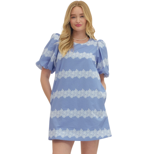 Elevate your wardrobe with this charming Entro puff sleeve mini dress, featuring a delicate blue floral print that brings effortless elegance to any occasion. The short puffed sleeves add a playful, feminine touch while the mini silhouette keeps things fresh and modern. Perfect for spring outings, casual dates, or weekend adventures. This dress combines comfort with style, making it an easy go-to piece for creating memorable looks.