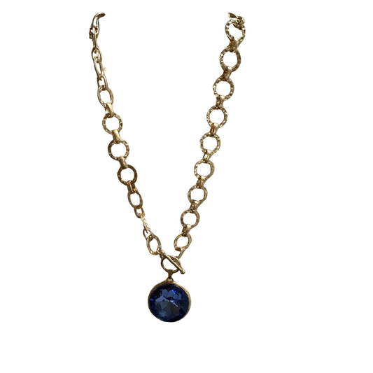 Elevate your everyday style with this striking Chain Link Pendant Necklace from Perdido Gem. Featuring a captivating blue pendant suspended from a sophisticated gold chain link design, this short necklace offers versatile elegance for layering or wearing solo. The refined craftsmanship and balanced proportions make it a timeless addition to any jewelry collection, seamlessly transitioning from casual to refined occasions.