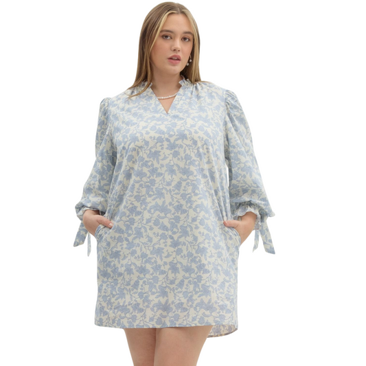 This Floral Mini Dress is the perfect addition to your wardrobe, featuring a beautiful floral print and ¾ puff sleeves with an elasticated opening accented with fixed ribbon. With convenient side pockets and a lightweight, non-sheer material, this dress is both stylish and functional. Stay comfortable and chic in this lined, woven mini dress.