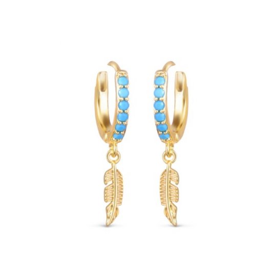 Up your style game with these Blue Stone Feather Earrings from Amanda Blu. These dainty 18K gold dipped huggie earrings feature bright blue cubic zirconia stones along the hoop and dangling gold feathers. You're sure to make a statement with these gorgeous earrings!