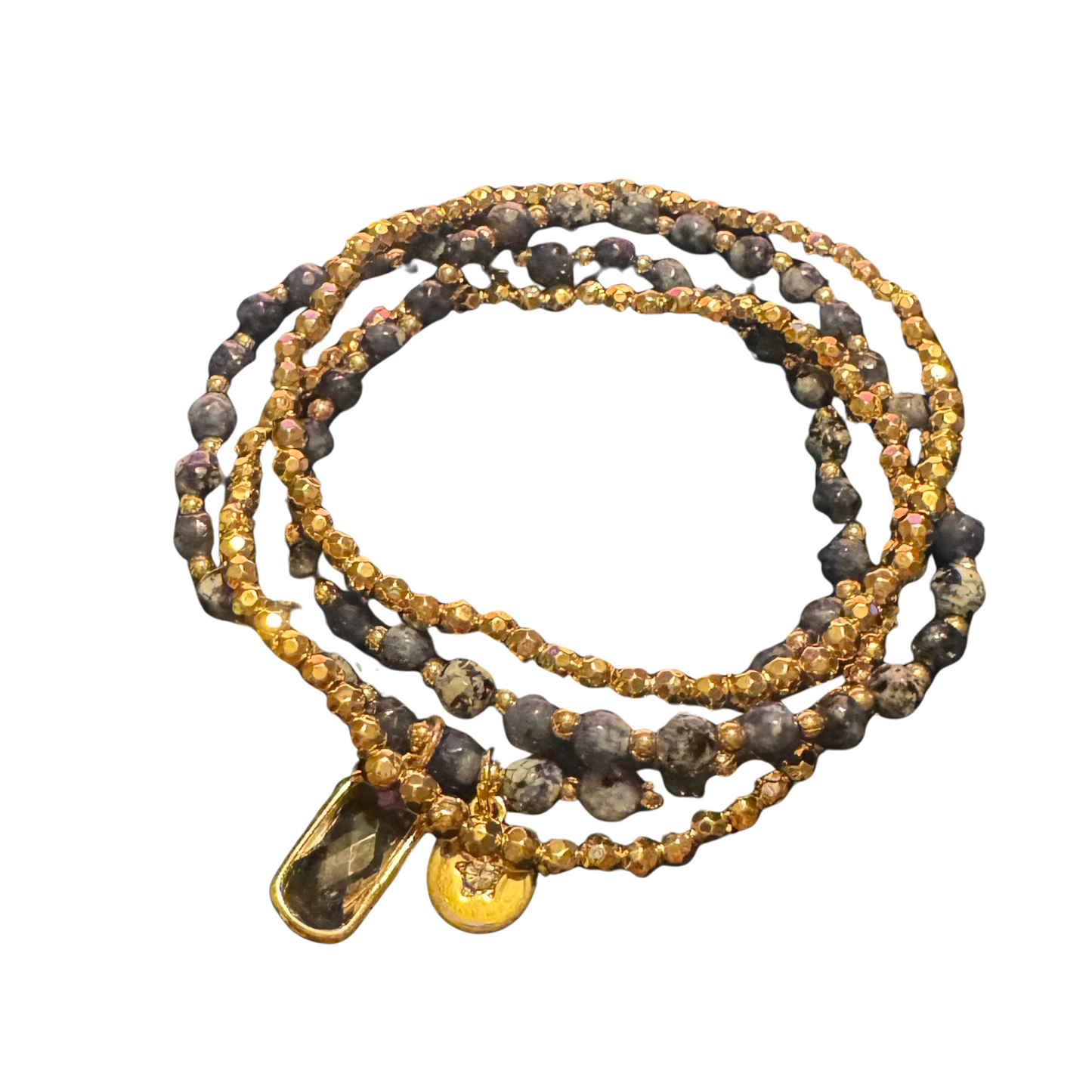 These Beaded Stretchy Bracelets are expertly crafted with an elegant layered design and stretchy material for a comfortable fit. The combination of blue and gold beads adds a touch of sophistication, while the clear pendant adds a subtle yet stylish detail. Perfect for any occasion.