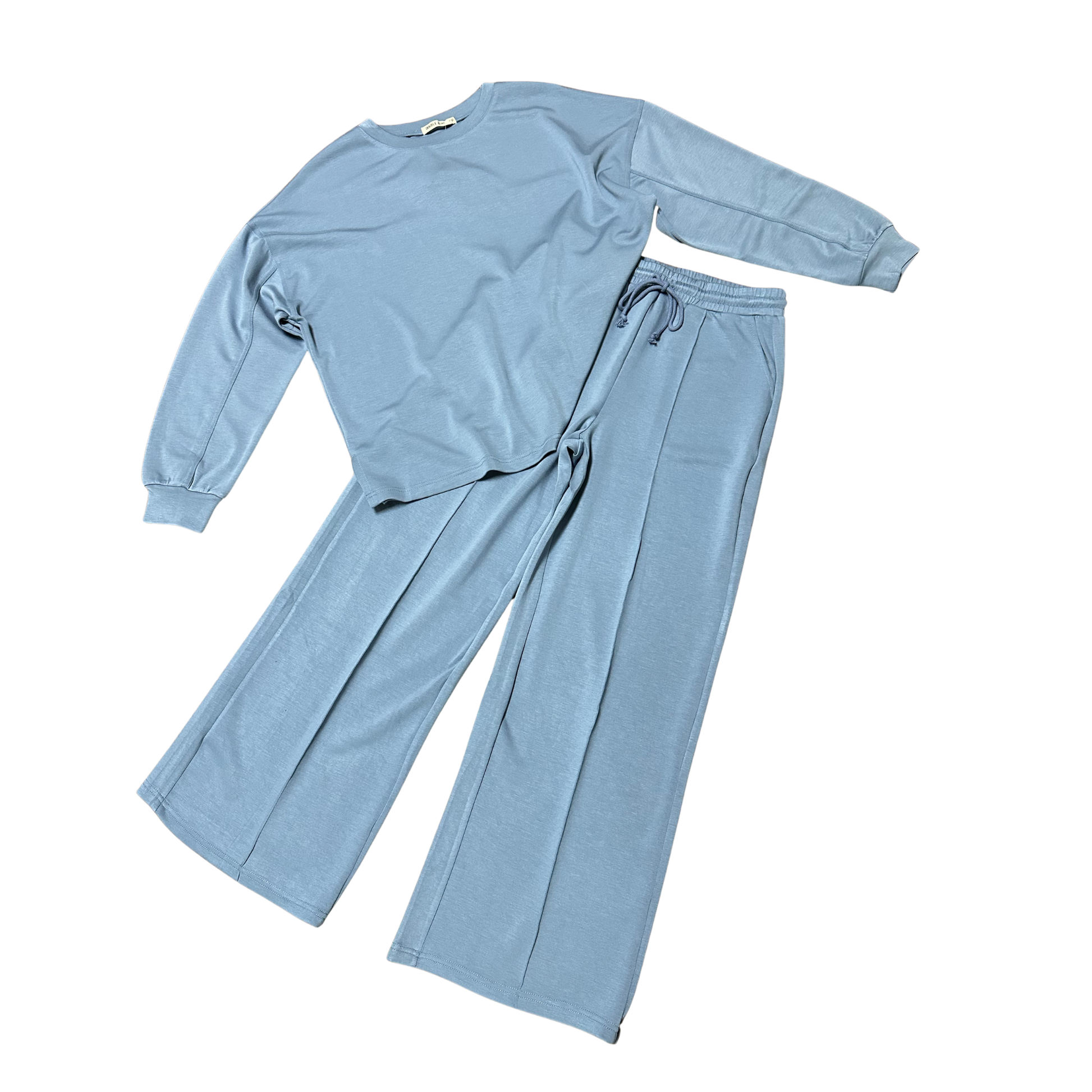 Elevate your everyday style with this HYFVE Oversized Top and Pants Set in dusty blue. The long sleeve top features a relaxed, comfortable fit that pairs perfectly with coordinating bottoms for an effortless, put-together look. Ideal for casual outings, work-from-home days, or lounging in style. The soft, breathable fabric keeps you comfortable all day long. Complete your wardrobe with this versatile two-piece set that transitions seamlessly from day to night.