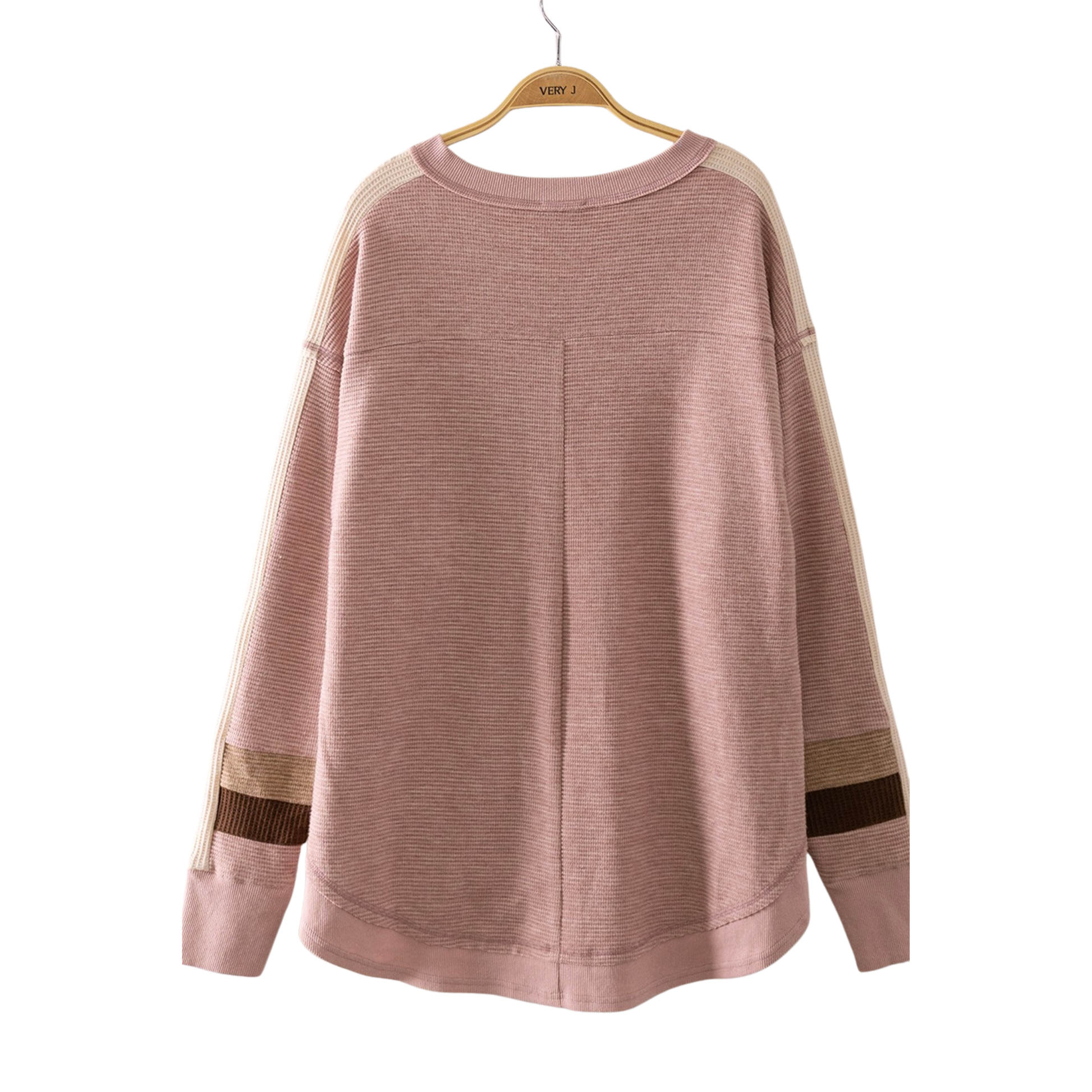 Experience effortless comfort in this Waffle Knit Pullover Sweater by Very J. The soft, textured waffle knit fabric provides warmth without bulk, while the flattering V-neck and long sleeves offer a versatile look perfect for layering or wearing solo. The blush color adds a gentle, sophisticated touch to any casual wardrobe. Ideal for cool-weather styling that transitions seamlessly from day to night.