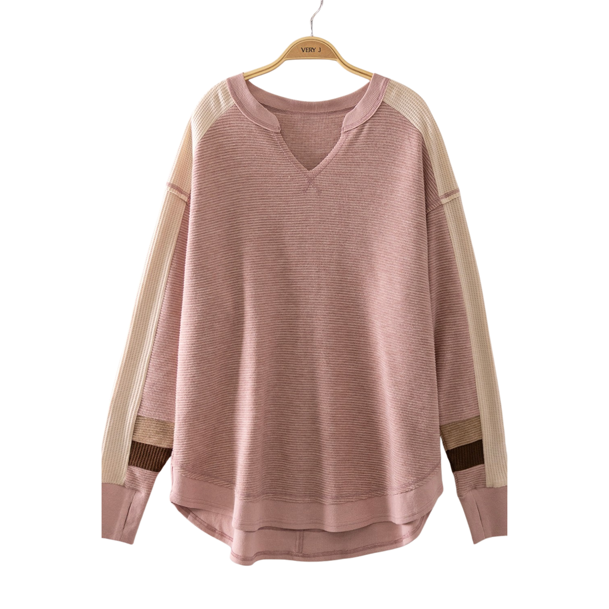 Experience effortless comfort in this Waffle Knit Pullover Sweater by Very J. The soft, textured waffle knit fabric provides warmth without bulk, while the flattering V-neck and long sleeves offer a versatile look perfect for layering or wearing solo. The blush color adds a gentle, sophisticated touch to any casual wardrobe. Ideal for cool-weather styling that transitions seamlessly from day to night.