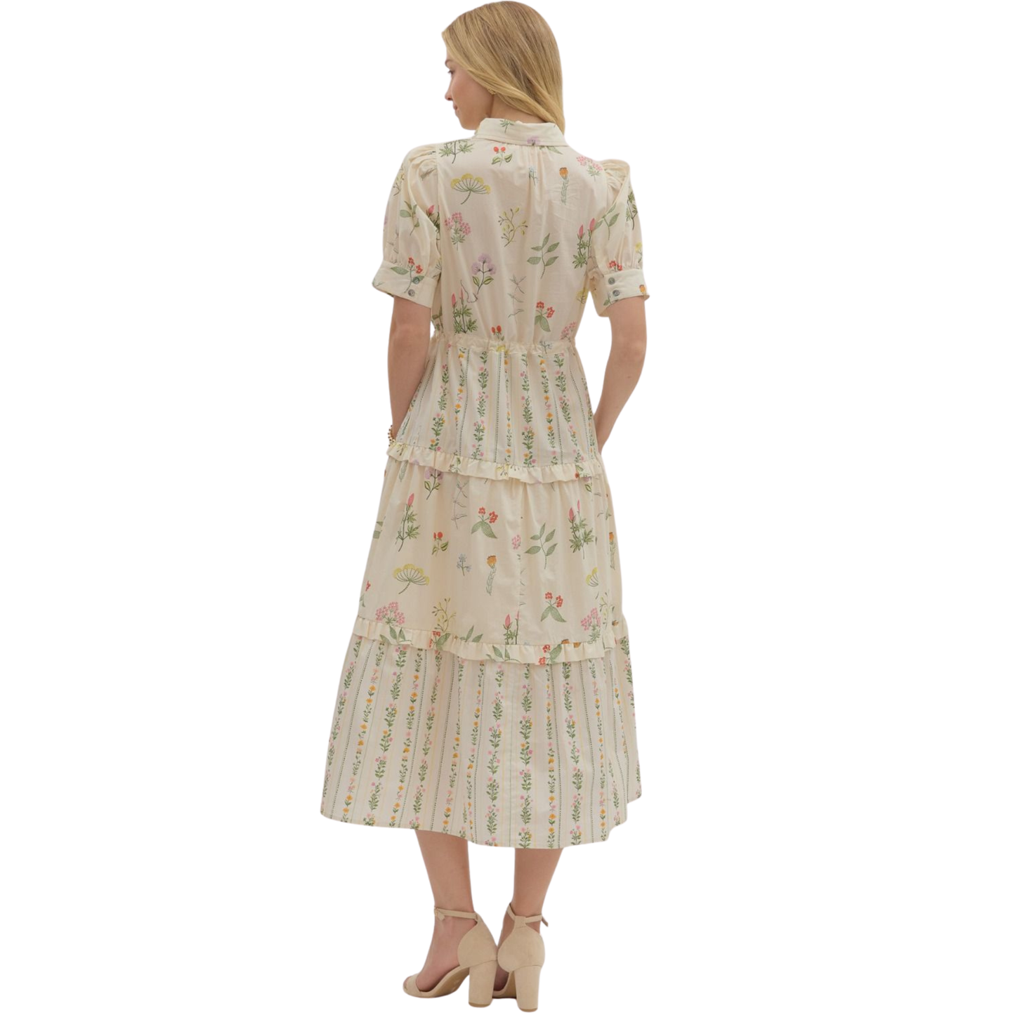 Elevate your seasonal wardrobe with this Entro botanical print midi dress, designed for effortless sophistication. The vibrant floral pattern brings natural elegance to any occasion, while the flattering midi length offers versatile styling options from casual outings to elevated events. Short sleeves provide comfortable breathability, making this piece ideal for transitional weather. 