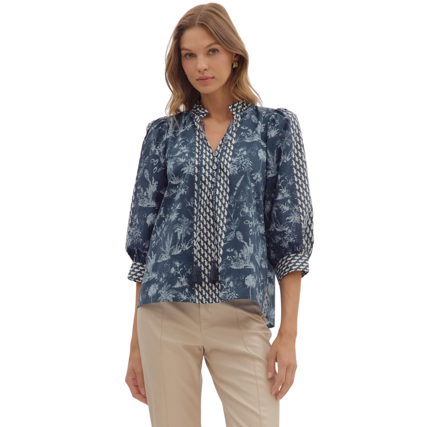 This Entro botanical print top combines classic design with nature-inspired elegance. Featuring a flattering V-neck and a structured collar, it offers a polished look suitable for both casual and professional settings. The 3/4 length sleeves provide comfortable coverage, making it ideal for transitional weather. Crafted with attention to detail, this top delivers style and versatility in one refined piece.