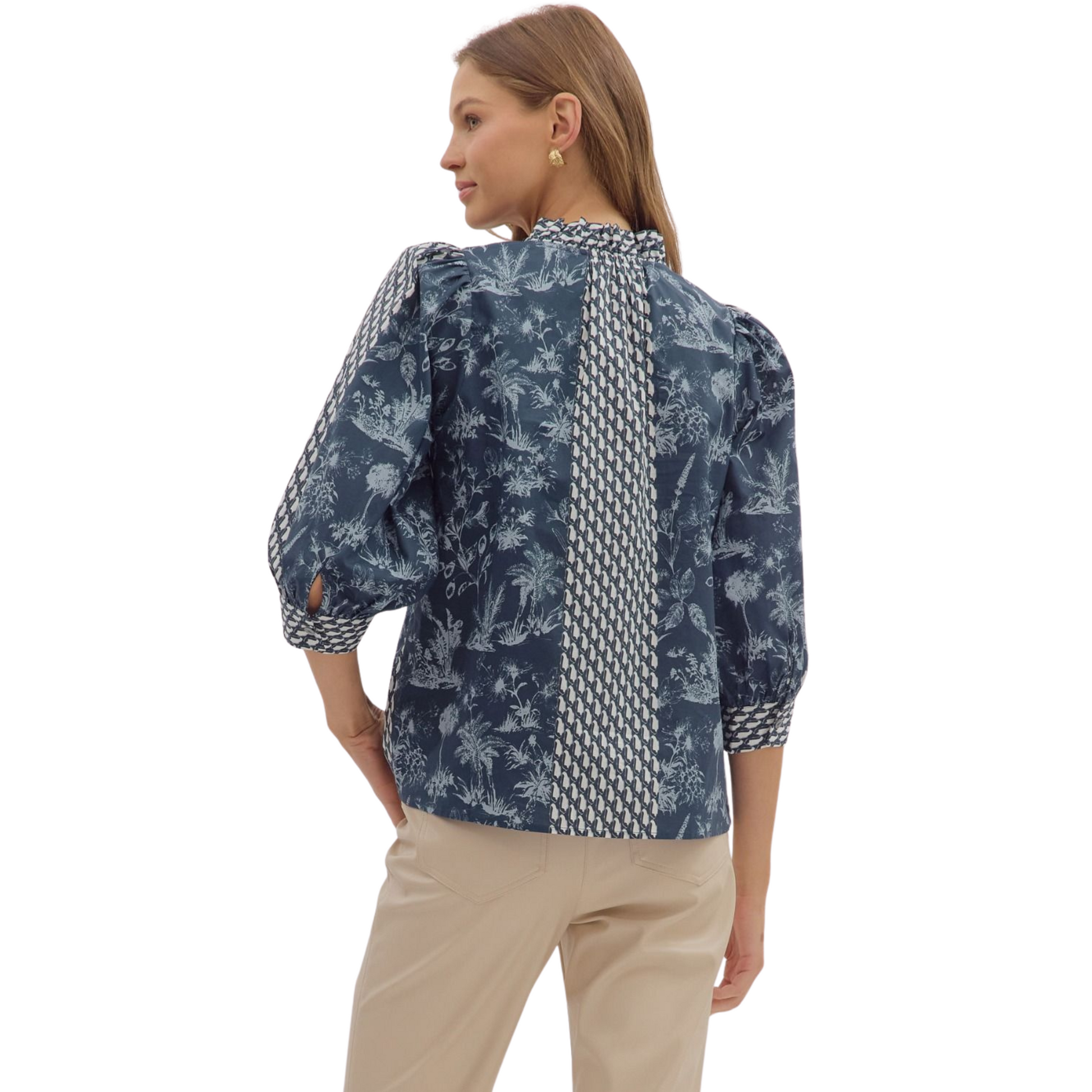 This Entro botanical print top combines classic design with nature-inspired elegance. Featuring a flattering V-neck and a structured collar, it offers a polished look suitable for both casual and professional settings. The 3/4 length sleeves provide comfortable coverage, making it ideal for transitional weather. Crafted with attention to detail, this top delivers style and versatility in one refined piece.