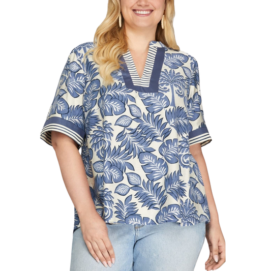 Elevate your everyday wardrobe with this stunning Woven Print Top from She+Sky. Featuring a serene botanical print in rich blue tones, this piece brings natural elegance to any outfit. The flattering V-neckline creates a refined silhouette while the quality woven fabric ensures comfort and durability. Perfect for layering or wearing solo, this versatile top transitions seamlessly from casual days to dressed-up occasions. 
