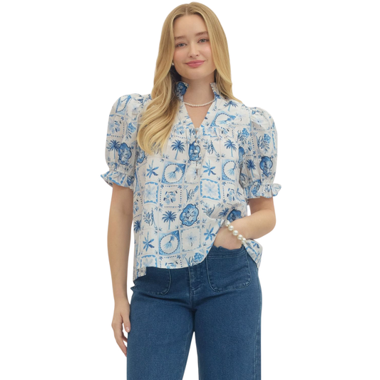 Elevate your wardrobe with this stunning Botanical Print Puff Sleeve Top by Entro. Featuring a vibrant blue botanical print that brings nature-inspired elegance to your everyday style, this top combines timeless charm with modern flair. The signature puff sleeves add a romantic, feminine touch while maintaining a flattering silhouette. Perfect for casual outings, brunch dates, or layering under your favorite jacket.