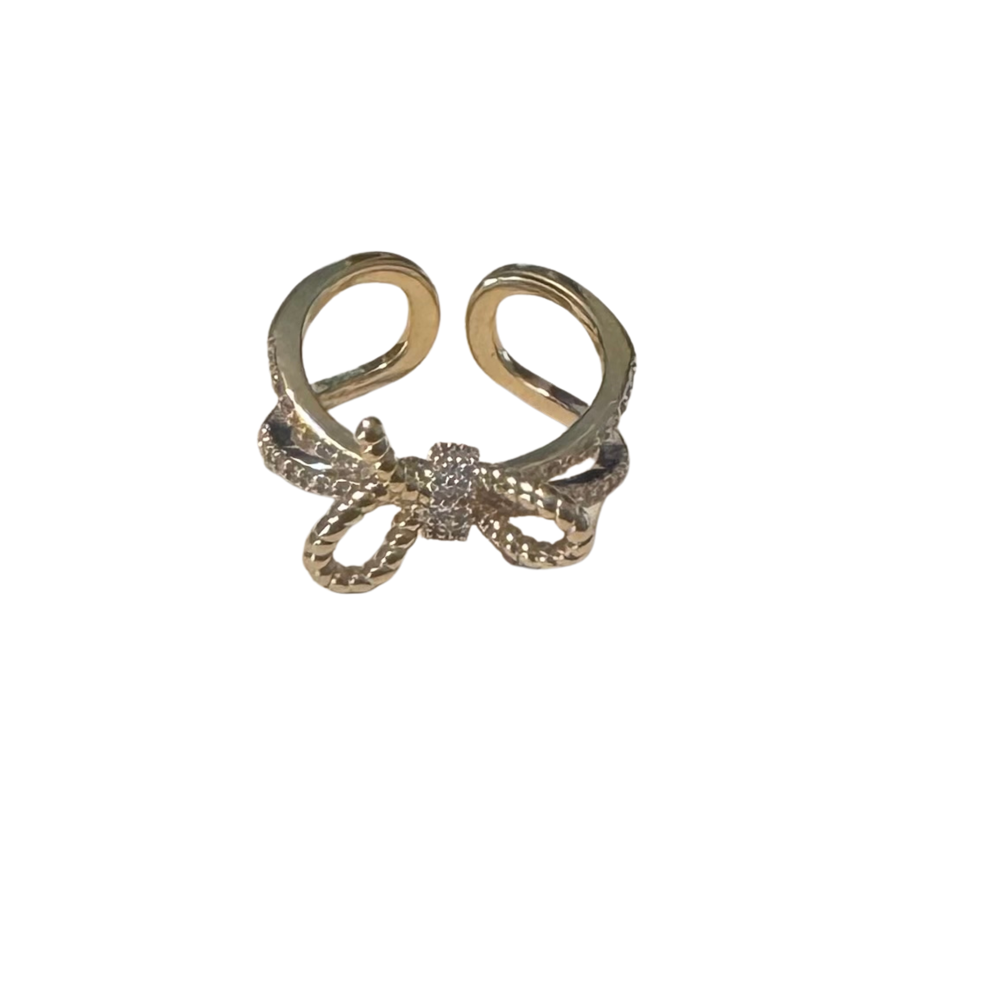 This Bowtie Ring from Perdido Gems showcases masterful design with its distinctive bow-shaped silhouette rendered in radiant gold. Strategically placed rhinestone accents enhance the piece with brilliant sparkle and dimensional appeal. The expert construction ensures durability while maintaining the refined aesthetic that defines contemporary luxury jewelry. 