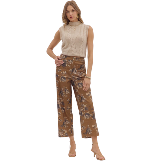 These mid-rise ankle-length pants by Entro feature a delicate floral pattern on a lightweight, woven fabric that ensures comfort without transparency. Designed with a button and zip-fly closure, they offer a secure fit complemented by practical patch pockets at both front and back. Their unlined construction maintains breathability, making them ideal for warm weather while retaining a polished, expert look. Perfect for those seeking stylish, versatile pants with attention to detail.