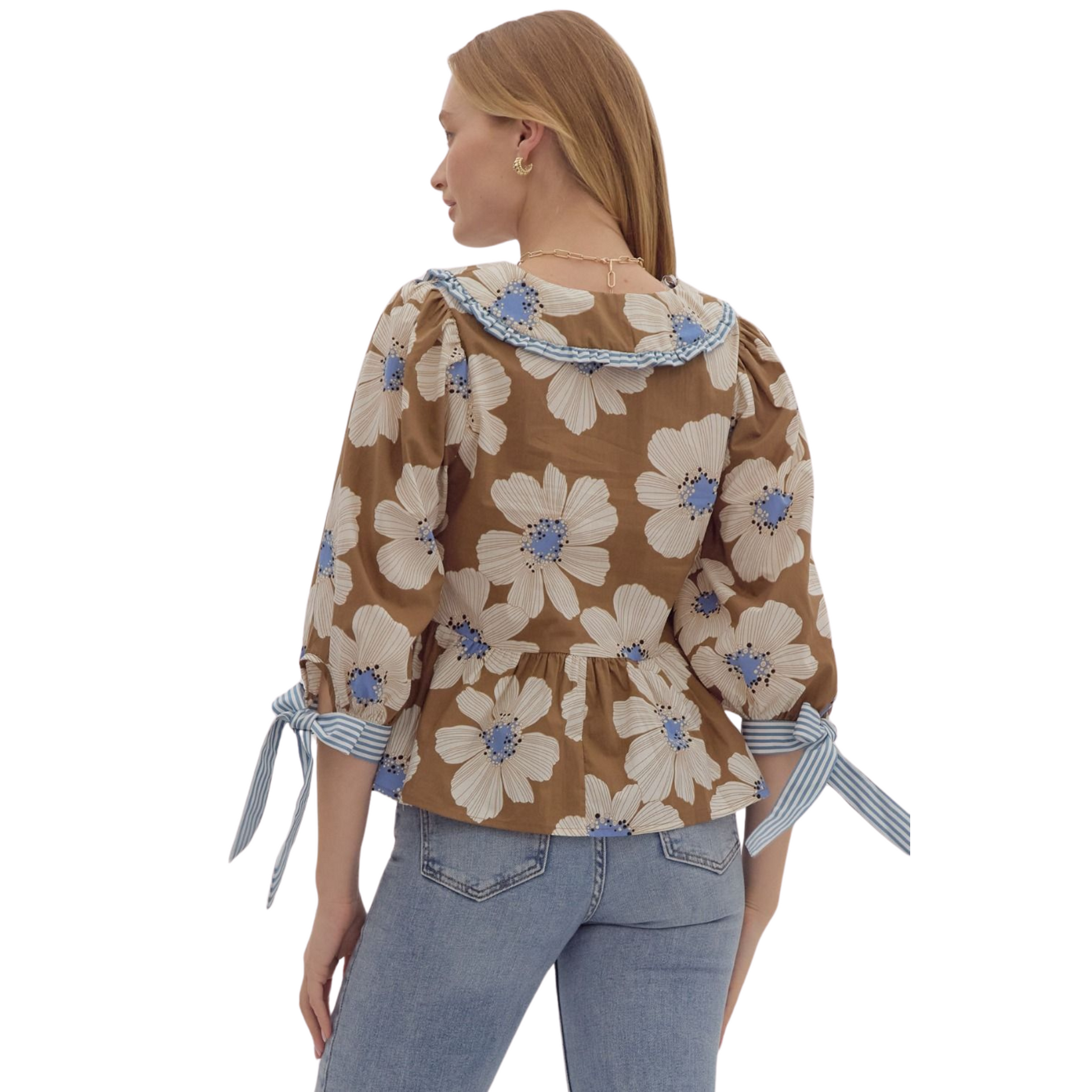 Discover playful elegance with our Floral Print Peplum Top. This relaxed fit top features a charming ruffle-edged peter pan collar and adjustable ribbon tie closure. The ¾ puff sleeves add a touch of femininity. In a beautiful brown color, this woven top is non-sheer, lightweight, and perfect for any occasion. Add a touch of romance to your wardrobe today.