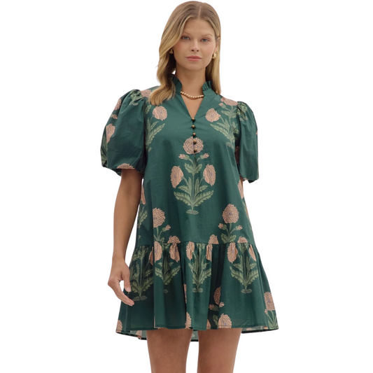 This Entro mini dress in hunter green features a delicate floral design, combining elegance with a fresh, natural vibe. Its bubble sleeves add a modern, voluminous touch, while the ruffle hem and ruffle neckline enhance the silhouette with a soft, feminine flair. Ideal for confident, stylish occasions, this dress balances playful detailing with sophisticated craftsmanship.