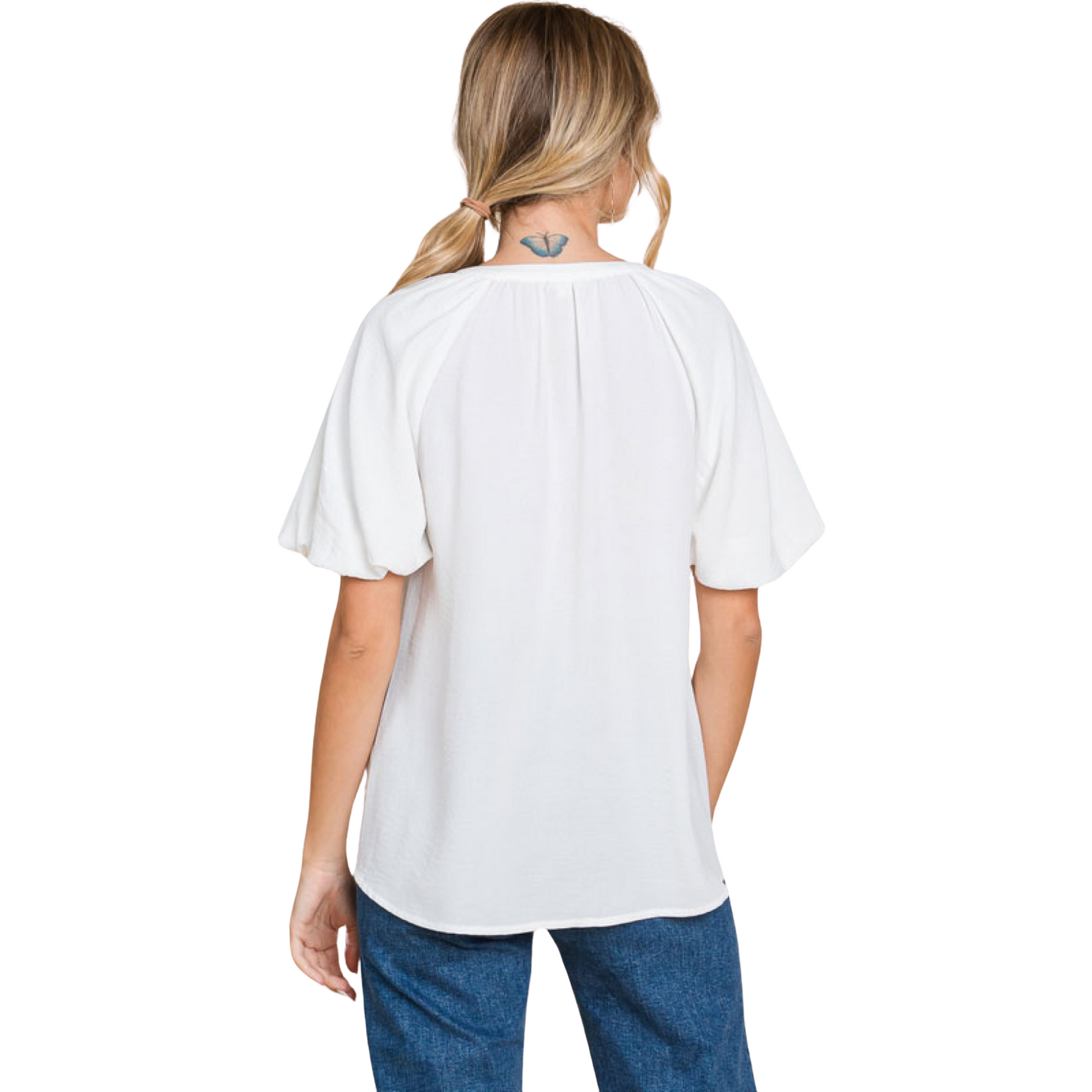 The Balloon Sleeve Top in off white features a v neck design and trendy bubble sleeves. With a sophisticated and versatile style, this top is perfect for any occasion. Enhance your wardrobe with this must-have fashion piece.
