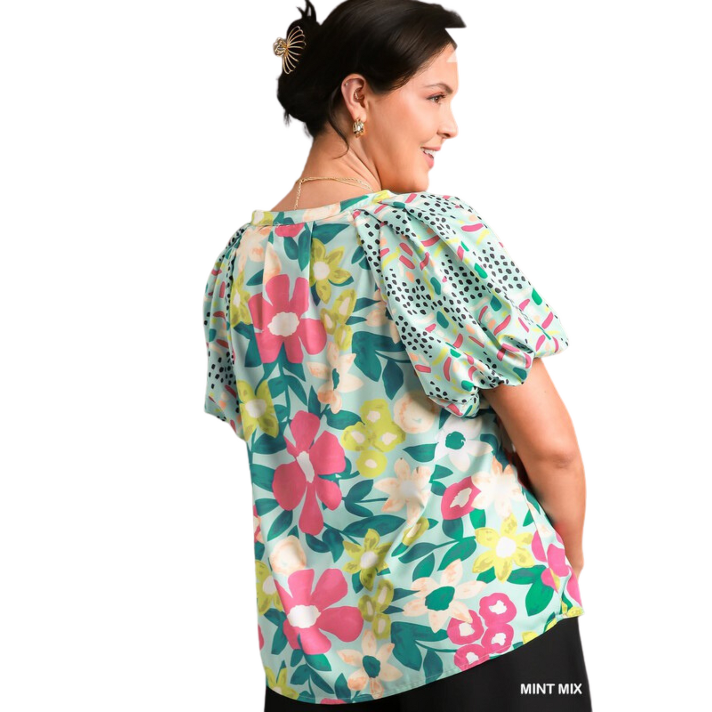 This Mixed Media Bubble Sleeve Top features a mint mix floral print and short sleeves for a flirty and whimsical look. Perfect for spring, its soft and lightweight fabric will keep you feeling comfortable all day.