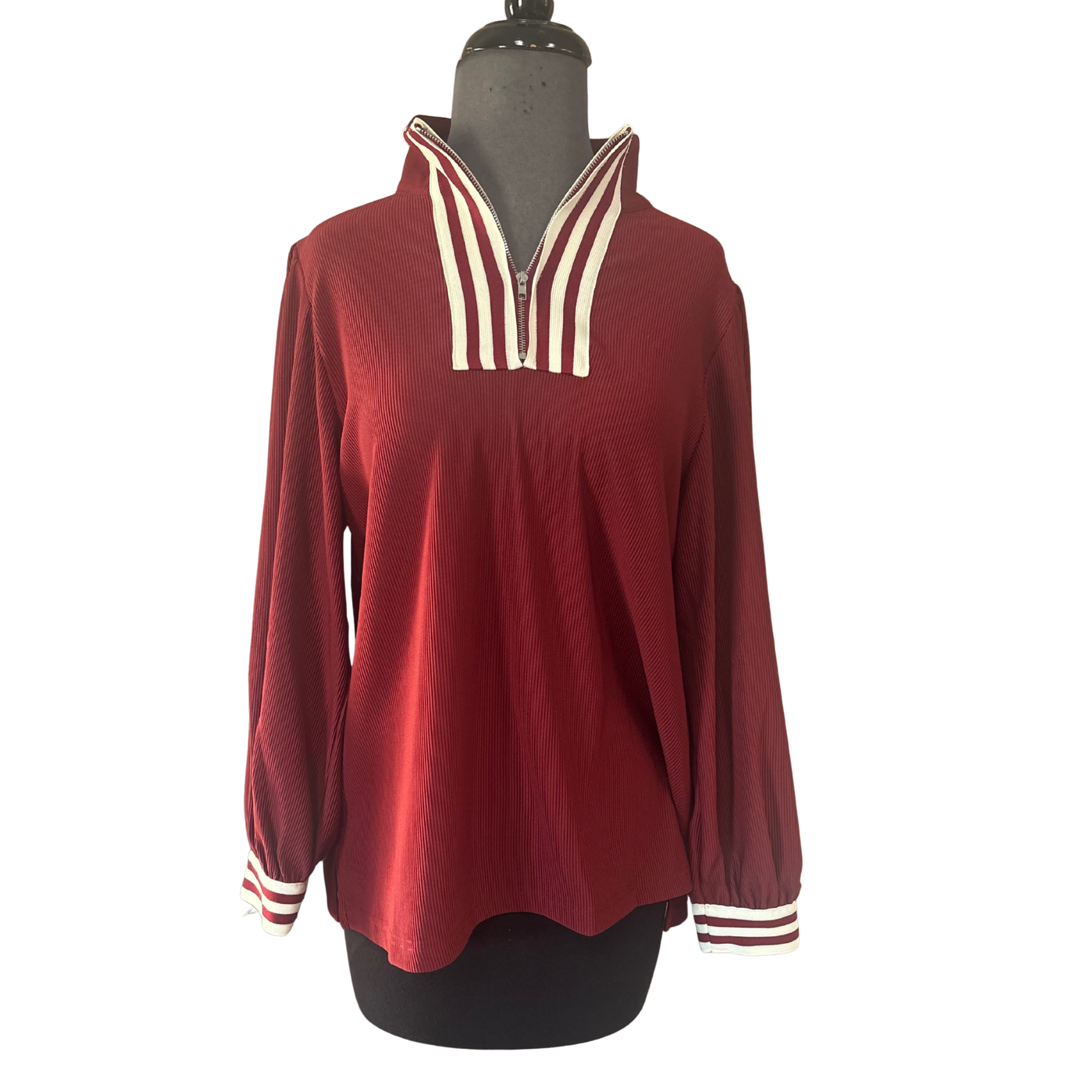 Elevate your layering game with this Jodifl half-zip long sleeve top in rich burgundy. The textured fabric adds visual interest and dimension while providing comfortable everyday wear. Perfect for transitional seasons, this versatile piece pairs effortlessly with jeans, leggings, or under jackets for a polished, put-together look. The half-zip design offers adjustable coverage and easy styling options.
