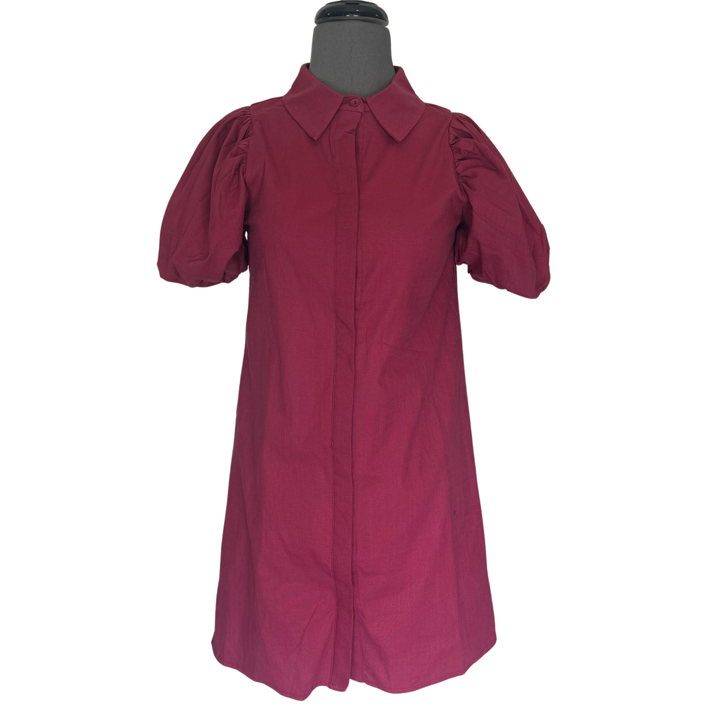 This crimson Button Down Shift Dress by T.C.E.C. features a collared, button down design with eye-catching puff sleeves. The perfect balance of sophistication and style, this dress is ideal for any professional or dressy occasion. Its vibrant color adds a touch of boldness to your wardrobe.