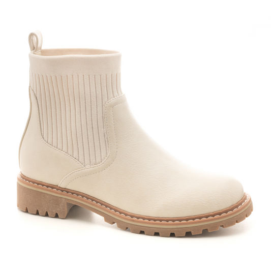 Cabin Fever from Corky's Brand are the perfect addition to your shoe collection. These cream-colored booties feature a stylish silhouette and a comfortable, flexible rubber sole. Wear them for a casual look, or elevate your outfit with a sophisticated style – it's up to you!