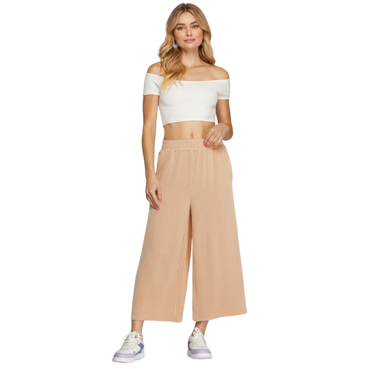 Textured Knit Capri Pants in a soft, light taupe hue that pairs effortlessly with any wardrobe. Crafted by She+Sky, these wide-leg pants offer a relaxed, comfortable fit perfect for everyday wear. The subtle texture adds visual interest while maintaining a refined, understated look. Ideal for casual outings or lounging at home, they deliver style without compromise.