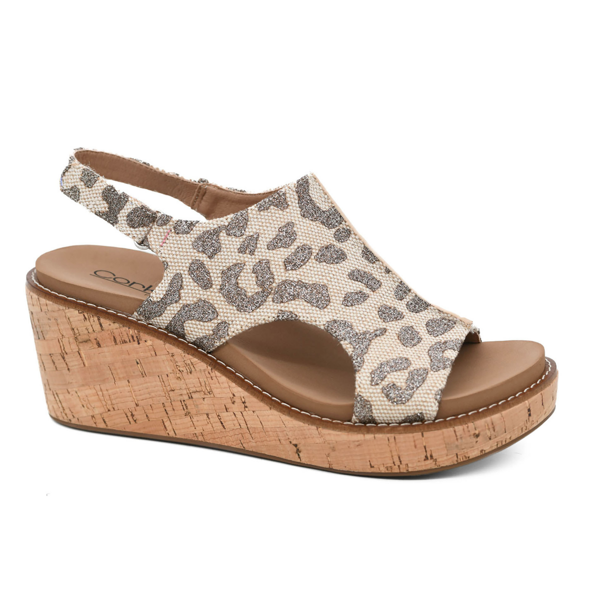 Step into style with Carley, the tan sparkle wedge sandal from Corky's. The leopard print adds a touch of fierce to this comfortable and trendy shoe. Elevate your wardrobe with confidence!