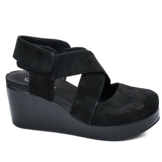 Case Closed wedges feature a sophisticated black faux suede design with closed toe for a sleek and polished look. Elevate your style with these timeless and versatile shoes.