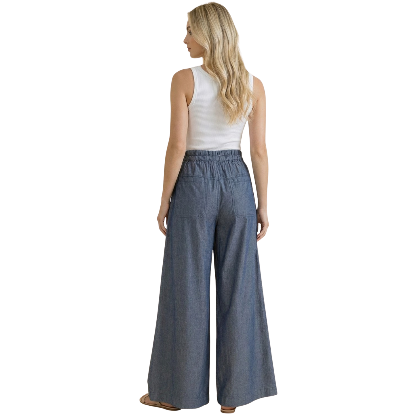 Effortless comfort meets timeless style with these Wide Leg Chambray Pants from Haptics. Crafted in a classic denim color, these pants feature a relaxed wide-leg silhouette that flatters all body types. The elastic waistband provides all-day comfort and ease of movement, while front button closures add a polished touch. Perfect for casual outings or dressed-up occasions, these versatile pants are a wardrobe essential.