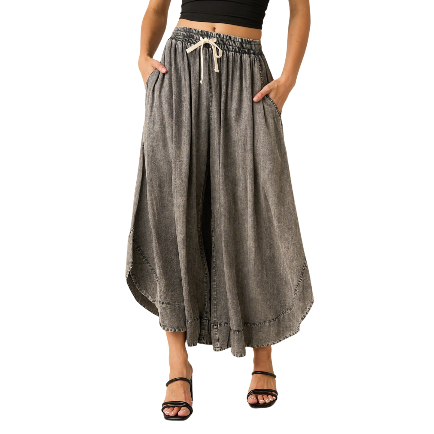 Effortless comfort meets contemporary style with these Mittoshop wide leg pants. Crafted in soft mineral-washed chambray, they feature a relaxed silhouette that flatters every frame. The elastic waist with drawstring adjustment ensures a customized fit, while the generous leg opening provides freedom of movement. Perfect for casual days or dressed-up occasions, these versatile pants transition seamlessly from day to night.