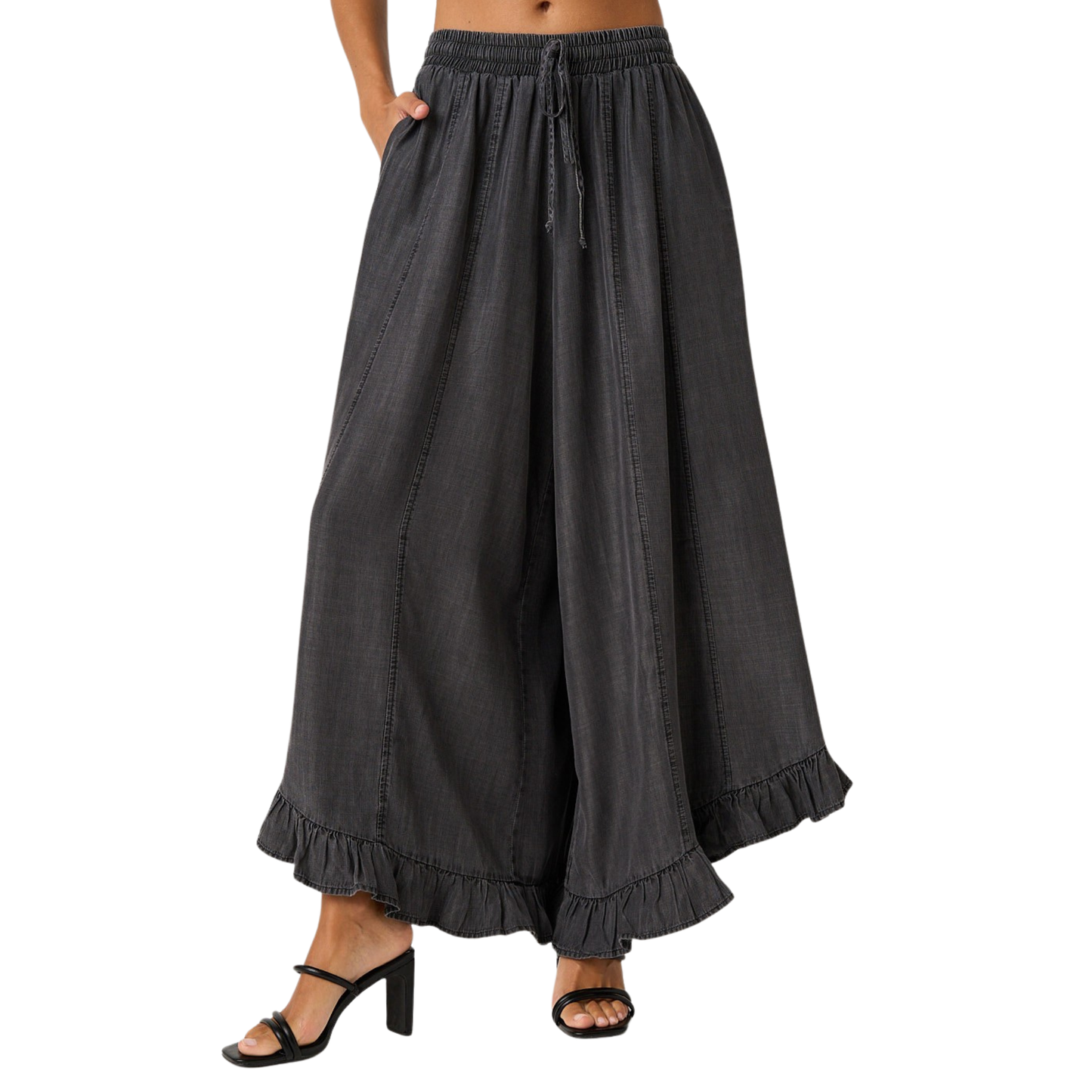 Elevate your everyday style with these Washed Chambray Ruffle Pants by Mittoshop. Crafted in soft, breathable chambray fabric, these wide-leg trousers feature a charming ruffle hem that adds movement and dimension. The adjustable drawstring waist ensures a comfortable, customizable fit for all-day wear. Perfect for casual outings or dressed-up occasions, this versatile piece transitions seamlessly from season to season.