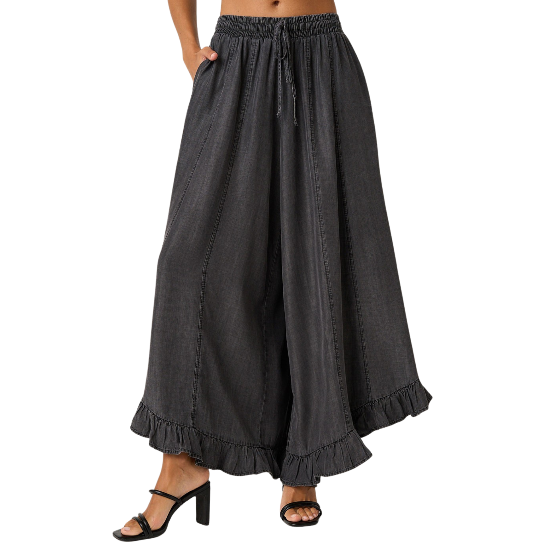 Elevate your everyday style with these Washed Chambray Ruffle Pants by Mittoshop. Crafted in soft, breathable chambray fabric, these wide-leg trousers feature a charming ruffle hem that adds movement and dimension. The adjustable drawstring waist ensures a comfortable, customizable fit for all-day wear. Perfect for casual outings or dressed-up occasions, this versatile piece transitions seamlessly from season to season.