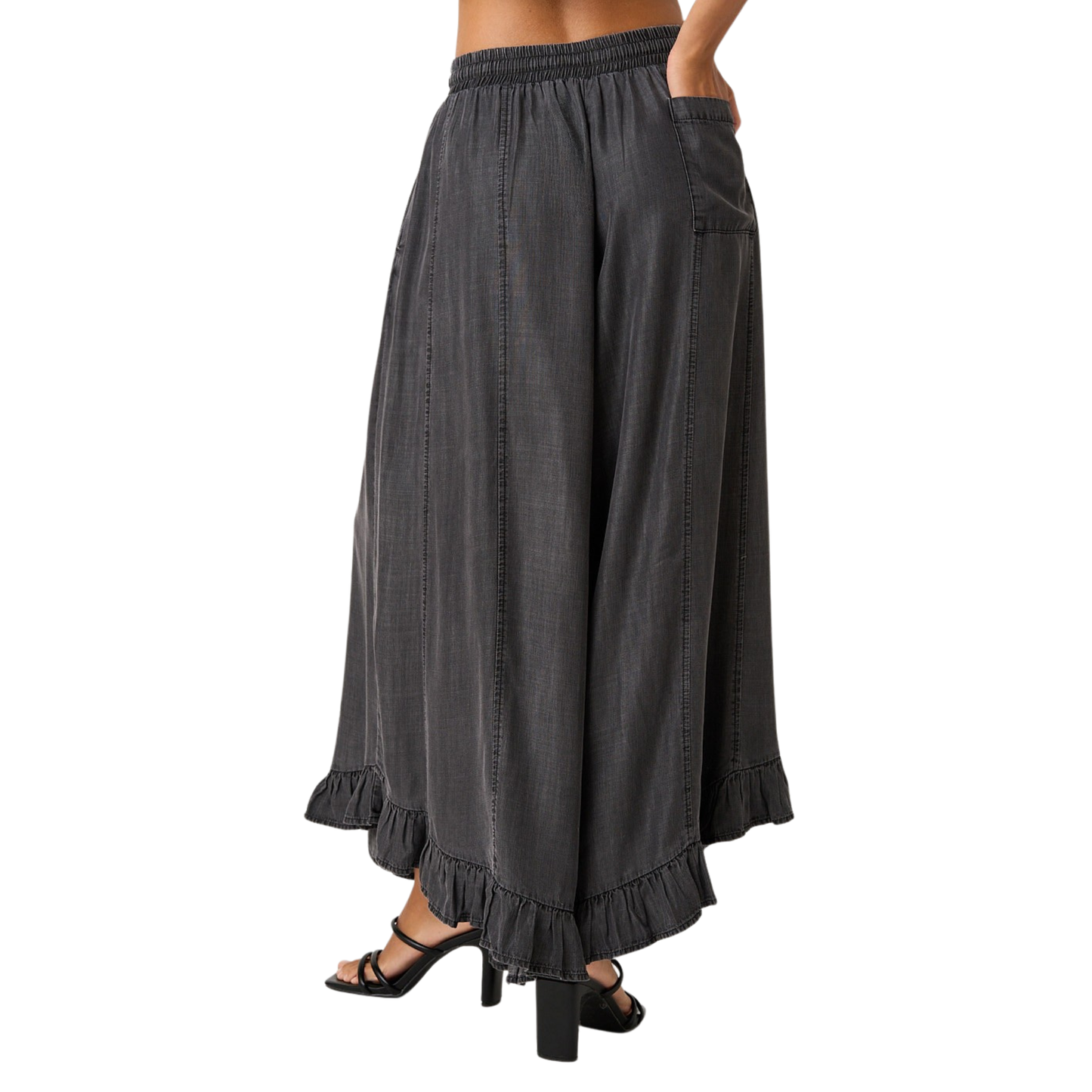 Elevate your everyday style with these Washed Chambray Ruffle Pants by Mittoshop. Crafted in soft, breathable chambray fabric, these wide-leg trousers feature a charming ruffle hem that adds movement and dimension. The adjustable drawstring waist ensures a comfortable, customizable fit for all-day wear. Perfect for casual outings or dressed-up occasions, this versatile piece transitions seamlessly from season to season.