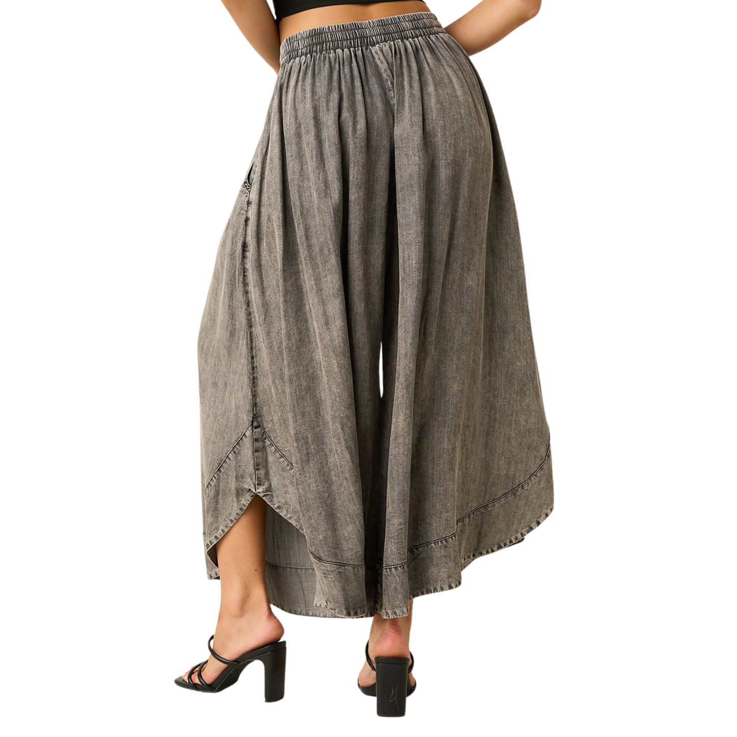 Effortless comfort meets contemporary style with these Mittoshop wide leg pants. Crafted in soft mineral-washed chambray, they feature a relaxed silhouette that flatters every frame. The elastic waist with drawstring adjustment ensures a customized fit, while the generous leg opening provides freedom of movement. Perfect for casual days or dressed-up occasions, these versatile pants transition seamlessly from day to night.