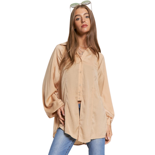 This Open Hem Button Up Top is fabricated with a silky washed dull satin for a comfortable feel and a stylish look. It features an SPRIT open hem front, perfect for mixing and matching with any outfit. The button up closure ensures the top stays securely in place.