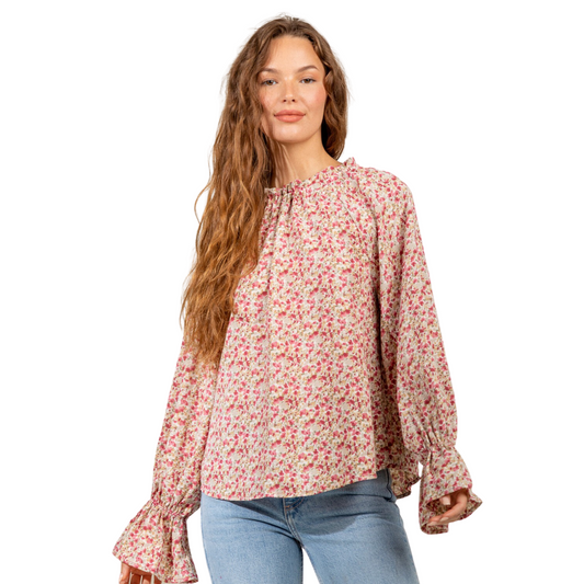 This Very J Brand  Floral Print Raglan Sleeve Top features beautiful floral prints and a classic bell sleeve design for an effortlessly chic look. The mock neckline and back tie detail add modern style to this sophisticated shirt, perfect for any season.