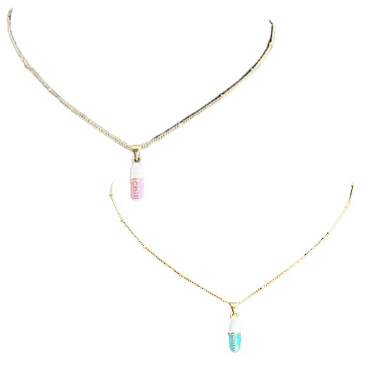 Our Chill Pill Necklace is a stylish and unique accessory for any wardrobe. It features a bright pink or blue chill pill pendant suspended from a gold chain. Add a fun, light-hearted touch to your favorite looks and make a fashion statement you can truly be proud of.